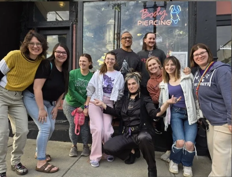 Bea and her community of clients celebrating outside As Above So Below on Castle Street
